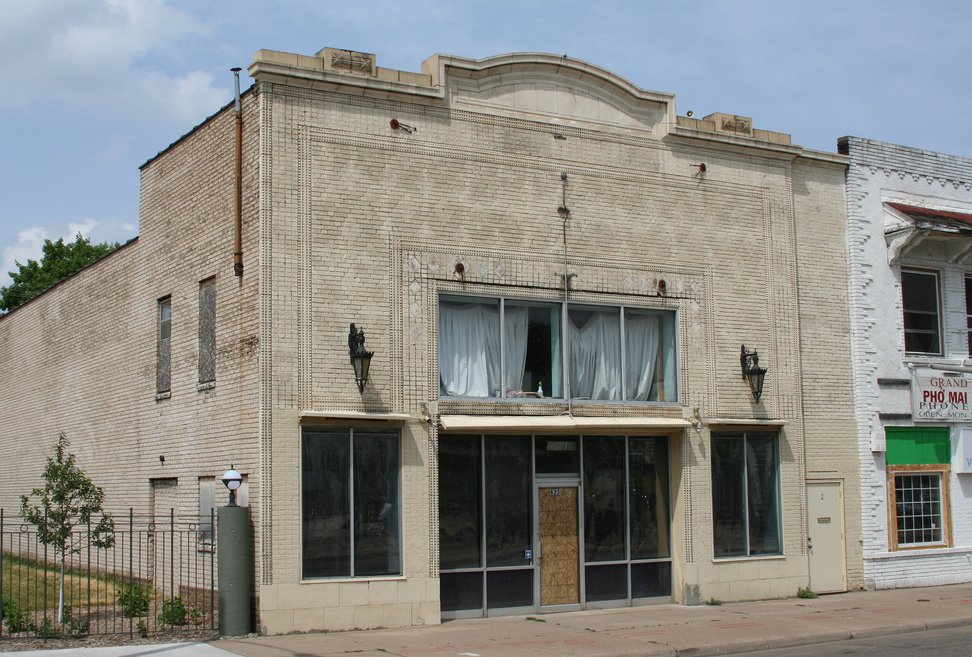 825 Arts when it was originally purchased by the city - it is a 1914 theater with a window above a set of storefront doors and windows. it is run down, but pleasant.