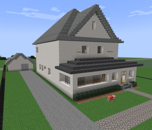 A minecraft model of the Lovejoy home. It is a three story house with grey trim and roofing, plus a well kept yard, detached garage, and screen porch.